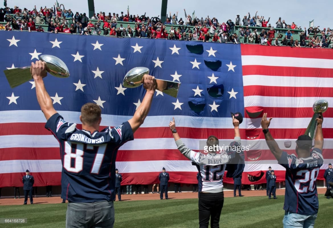 Tom Brady takes batting practice with Rob Gronkowski