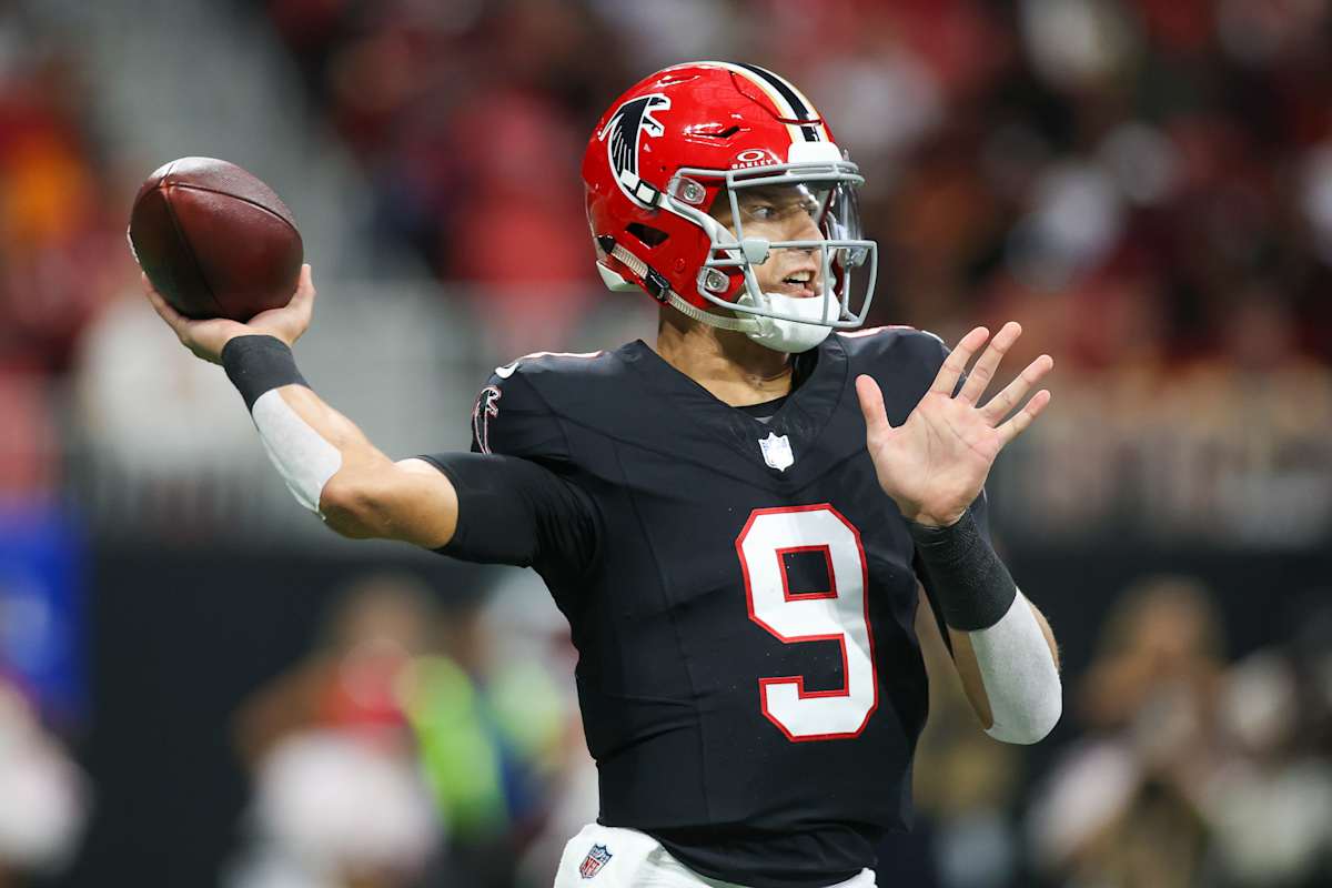 Quarterback Michael Vick of the Atlanta Falcons drops back to pass