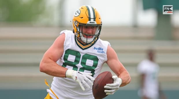 When do the Green Bay Packers report for training camp?