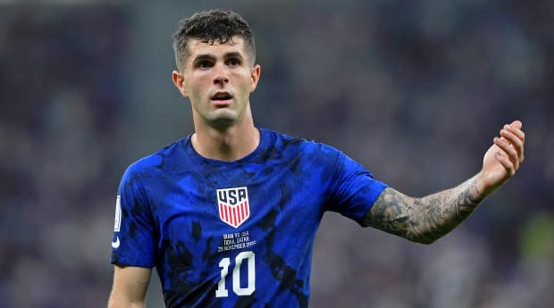 USA celebrate with 'qualified' banner despite not reaching Qatar World Cup  yet, as Christian Pulisic scores hat-trick and dedicates worm celebration  to young fan