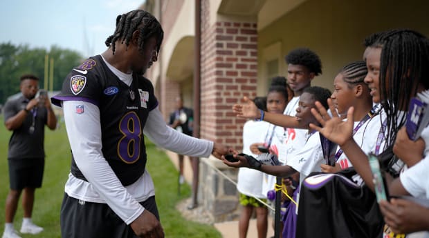 Young Ravens Fan Had Priceless Reaction to High-Fiving Lamar Jackson