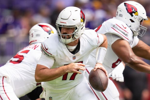 Arizona Cardinals quarterback Colt McCoy runs with the football