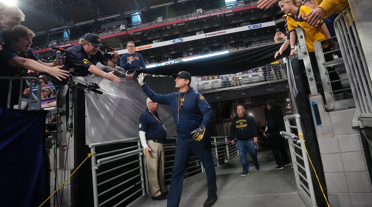 Michigan's Jim Harbaugh 'interested' in returning to NFL, report says 