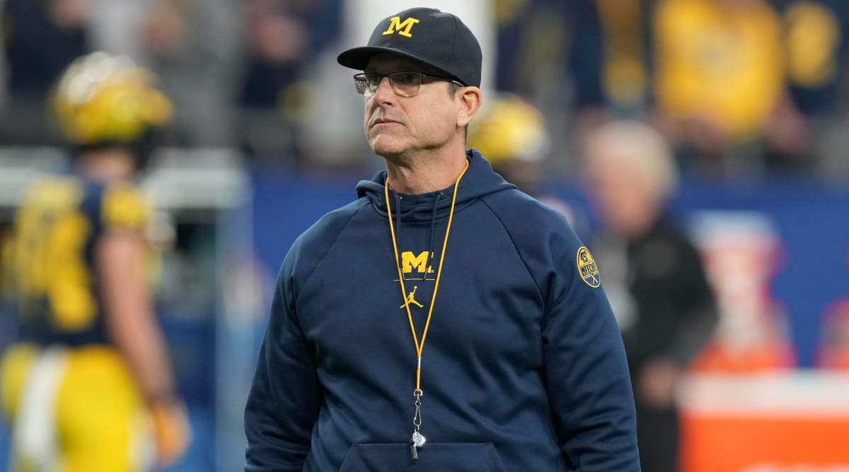 Jim Harbaugh calls Michigan president to say he's staying