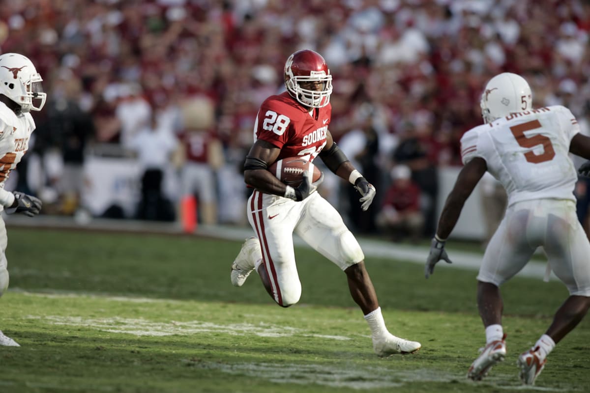 Adrian Peterson Oklahoma Sooners Unsigned Crimson Jersey Scoring Touchdown  vs. Kansas State Photograph