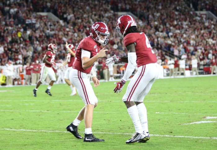 Mac Jones and Jerry Jeudy celebrate a big  play against Arkansas