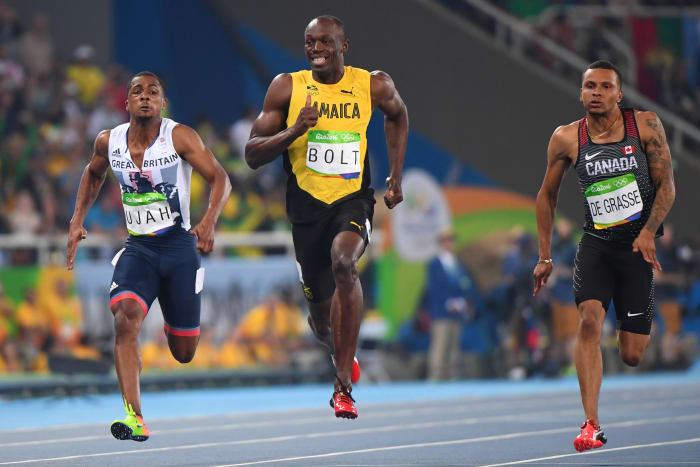 Usain Bolt smiles while running 100 meters (photos) - Sports Illustrated