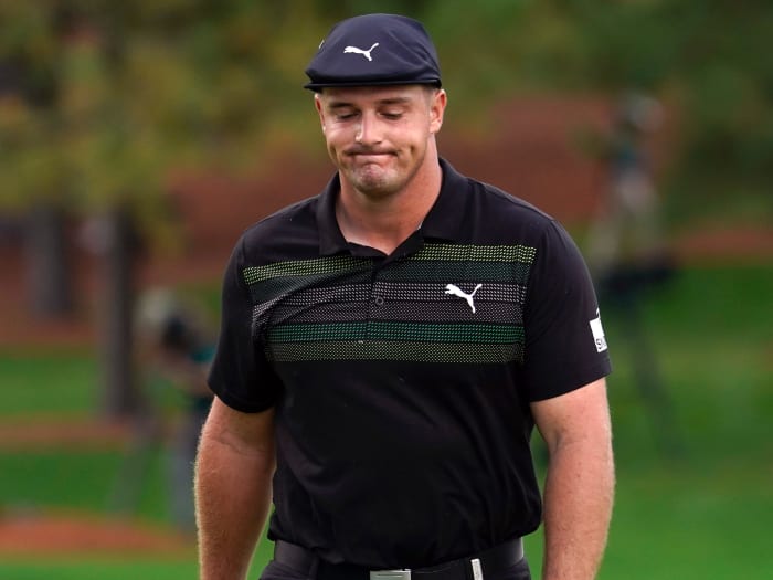 Bryson DeChambeau reacts after missing his putt on the seventh green in the first round of The Masters golf tournament