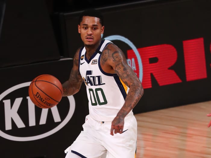 Utah Jazz guard Jordan Clarkson (00) takes the ball onto the court against Denver Nuggets center Nikola Jokic (15) during the first half of the seventh game of the first round of the 2020 NBA Playoffs