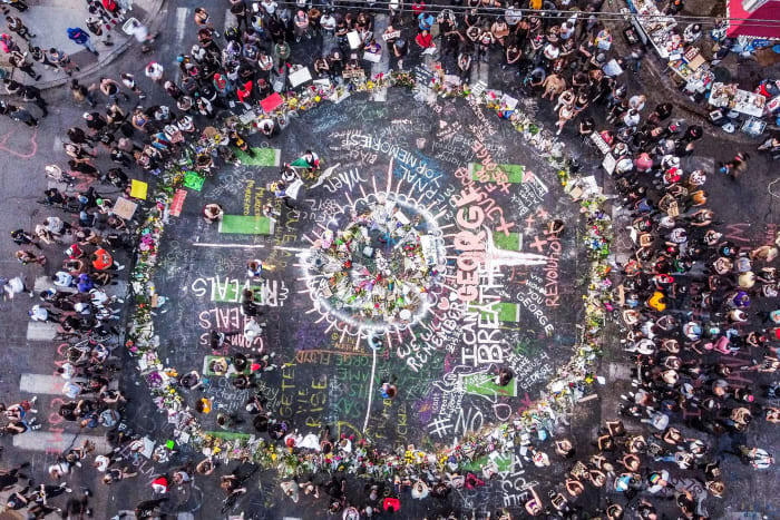 Protestors at a makeshift memorial for George Floyd in June