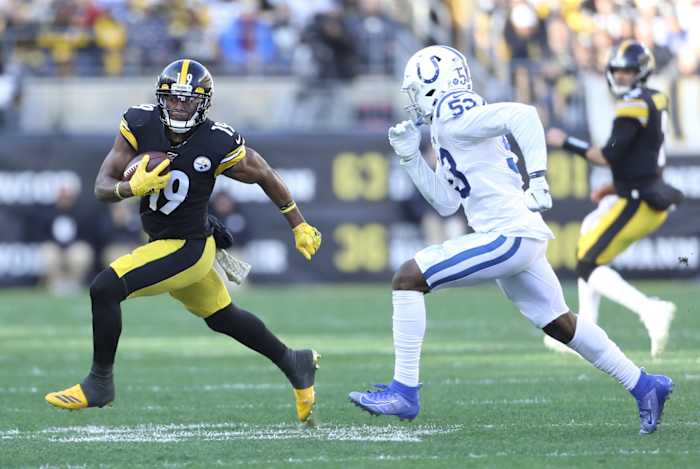 Pittsburgh Steelers wide receiver JuJu Smith-Schuster (19) tries to elude Indianapolis Colts linebacker Darius Leonard (53) in a 2019 game at Pittsburgh's Heinz Field.