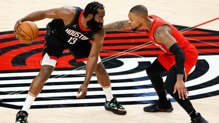 James Harden guarded by Damian Lillard