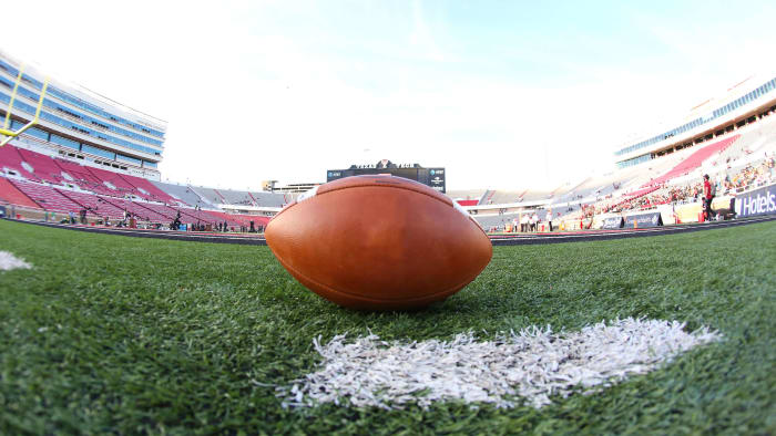 A football sits on the field at Texas Tech's stadium