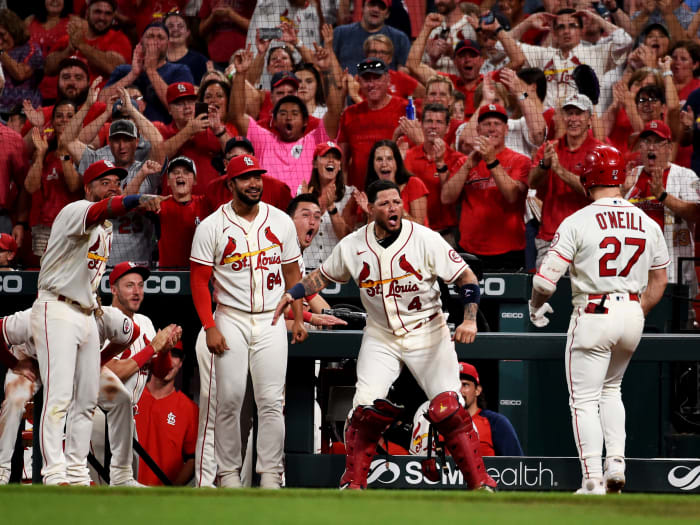 Sep 18, 2021; St. Louis, Missouri, USA; St. Louis Cardinals left fielder Tyler O'Neill (27) is congratulated after hitting a two-run home run against the San Diego Padres during the eighth inning at Busch Stadium.