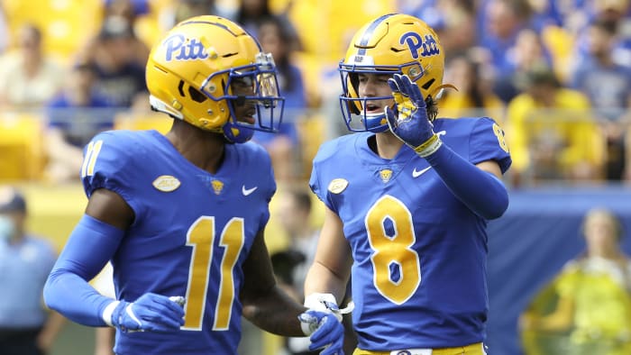 Pitt wide receiver Taysir Mack (11) and quarterback Kenny Pickett (8) talk