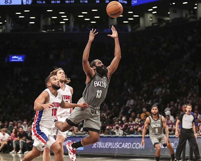 Oct 31, 2021; Brooklyn, New York, USA; Brooklyn Nets guard James Harden (13) loses the ball after driving between Detroit Pistons guard Cory Joseph (18) and forward Kelly Olynyk (13) in the third quarter at Barclays Center. Mandatory Credit: Wendell Cruz-USA TODAY Sports