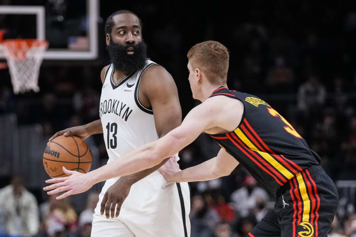 Dec 10, 2021; Atlanta, Georgia, USA; Brooklyn Nets guard James Harden (13) dribbles in front of Atlanta Hawks guard Kevin Huerter (3) during the first half at State Farm Arena. Mandatory Credit: Dale Zanine-USA TODAY Sports