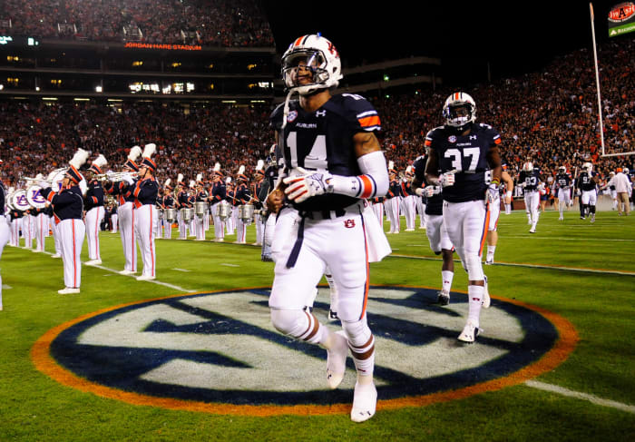 Oct 25, 2014; Auburn, AL, USA; Auburn Tigers quarterback Nick Marshall (14) runs onto the field for the game against the South Carolina Gamecocks at Jordan Hare Stadium. Auburn won 42-35. Mandatory Credit: Shanna Lockwood-USA TODAY Sports