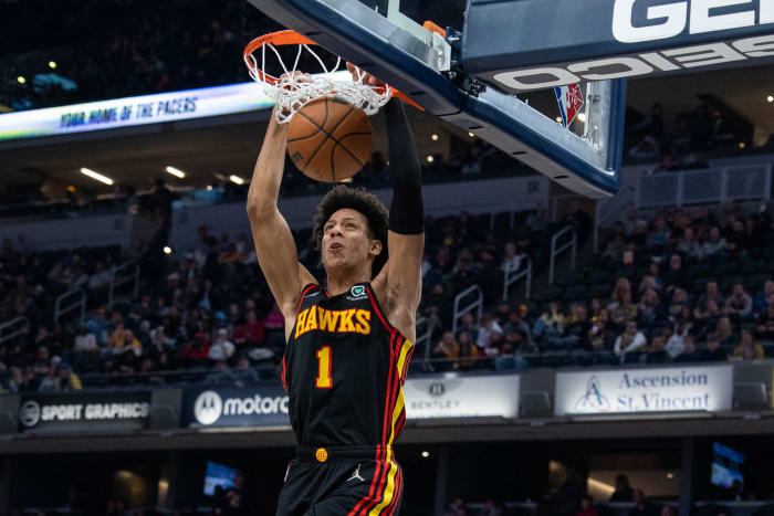 Jalen Johnson dunks the ball with two hands against Indiana.