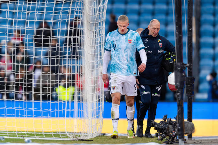 Erling Haaland leaves the pitch with an ankle injury after scoring two goals for Norway against Armenia in March 2022
