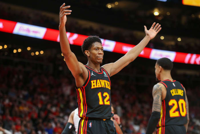 Apr 24, 2022; Atlanta, Georgia, USA; Atlanta Hawks forward De'Andre Hunter (12) reacts after being called for a foul against the Miami Heat in the second quarter during game four of the first round of the 2022 NBA playoffs at State Farm Arena.