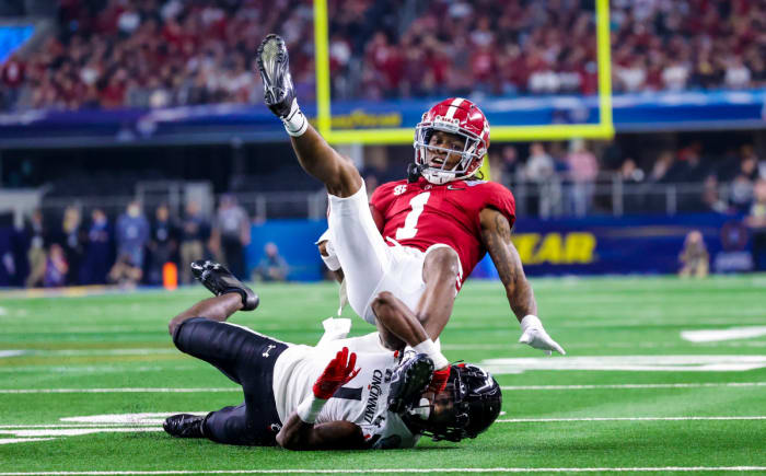 Cincinnati Bearcats cornerback Ahmad Gardner (1) tackles Alabama Crimson Tide wide receiver Jameson Williams (1) during the first half in the 2021 Cotton Bowl college football CFP national semifinal