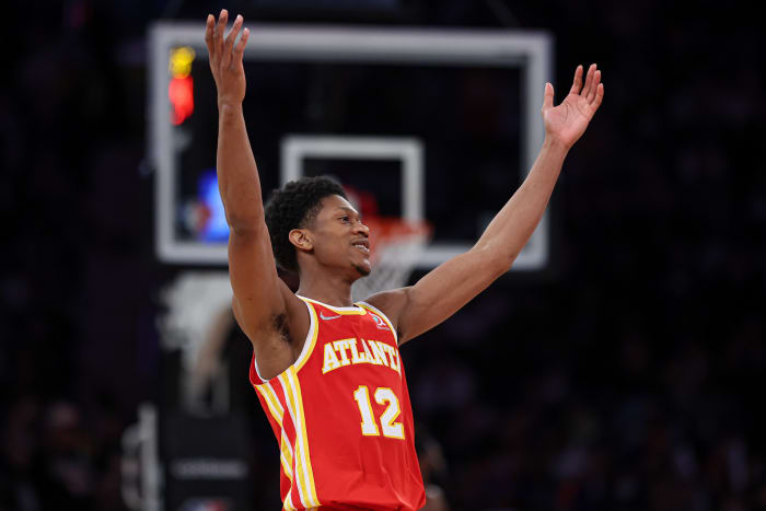 Atlanta Hawks forward De'Andre Hunter reacts to the shot.