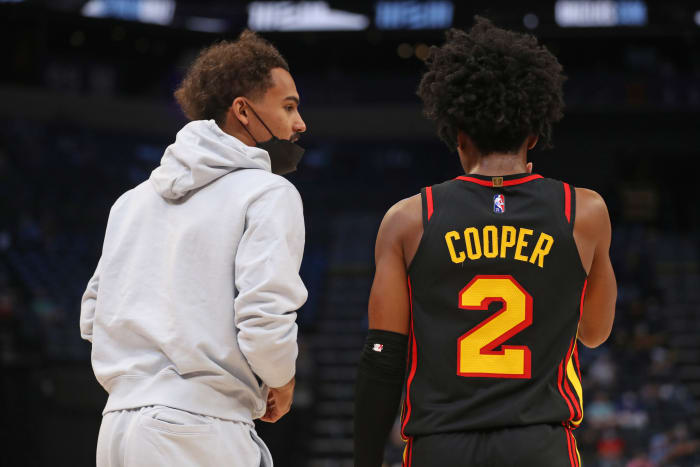 Atlanta Hawks guard Trae Young (left) talks with guard Sharife Cooper (2) during the second half against the Memphis Grizzlies at FedExForum.