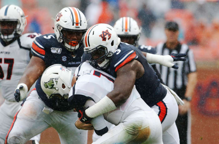 Nov 23, 2019; Auburn, AL, USA; Auburn Tigers defensive end Marlon Davidson (3) tackles Samford Bulldogs quarterback Liam Welch (7) during the second quarter at Jordan-Hare Stadium.