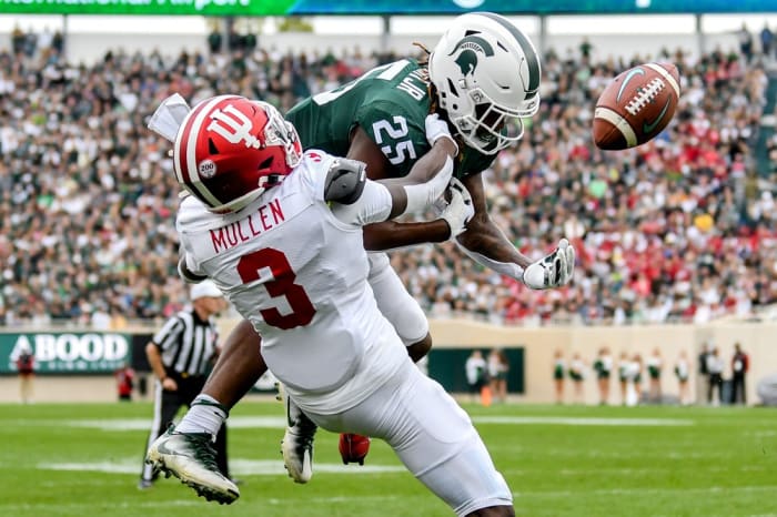Michigan State's Darrell Stewart Jr., top, can't hold on to the ball as Indiana's Tiawan Mullen defends during the second quarter on Saturday, Sept. 28, 2019, in East Lansing.