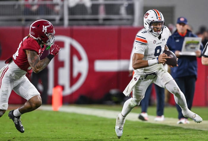 Robby Ashford (9) scrambles out of the pocket during the game between Auburn and Alabama at Bryant-Denny Stadium. Todd Van Emst/AU Athletics