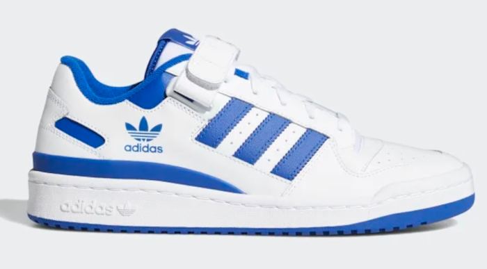 Side view of white and blue adidas shoes.