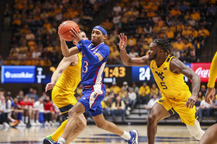 January 7, 2023; Morgantown, West Virginia, USA. Kansas Jayhawks guard Duff Anne Harris Jr. (3) drives down the lane against the Virginia Mountaineers of the West in the first half at the WVU Coliseum.