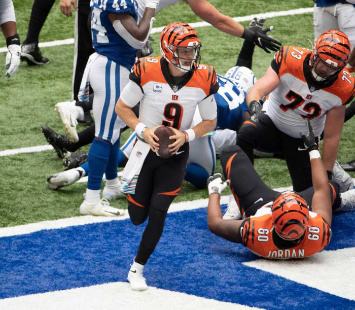 Oct 18, 2020; Indianapolis, IN, USA; Cincinnati Bengals quarterback Joe Burrow (9) celebrates after scoring a touchdown in the first quarter as the Indianapolis Colts host the Cincinnati Bengals at Lucas Oil Stadium in Indianapolis, Ind. on Saturday, October 18, 2020.