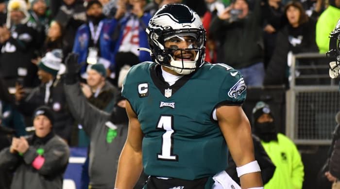 Eagles quarterback Jalen Hurts (1) celebrates a touchdown with wide receiver AJ Brown (11) during the second quarter of a playoff game against the Giants.