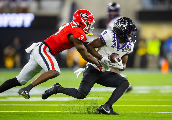 Jan 9, 2023; Inglewood, CA, USA; TCU Horned Frogs wide receiver Blair Conwright (0) is tackled by Georgia Bulldogs defensive back Kamari Lassiter (3) during the CFP national championship game at SoFi Stadium. Mandatory Credit: Mark J. Rebilas-USA TODAY Sports