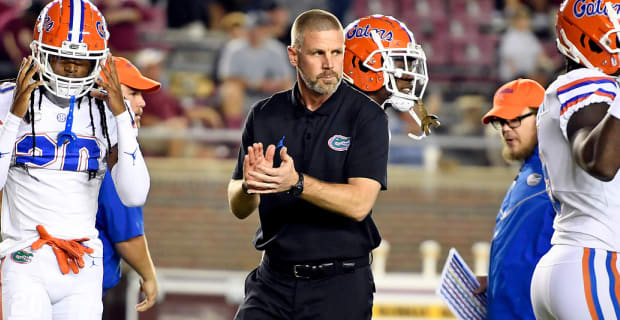 Florida Gators head coach Billy Napier stands on the sideline before kickoff of a college football game in the SEC.