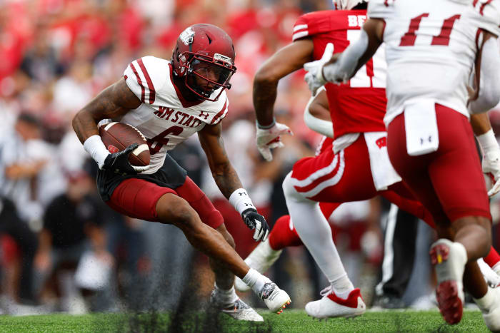 Sep 17, 2022; Madison, Wisconsin, USA; New Mexico State Aggies defensive back Syrus Dumas (6) returns an interception during the second quarter against the Wisconsin Badgers at Camp Randall Stadium. Mandatory Credit: Jeff Hanisch-USA TODAY Sports