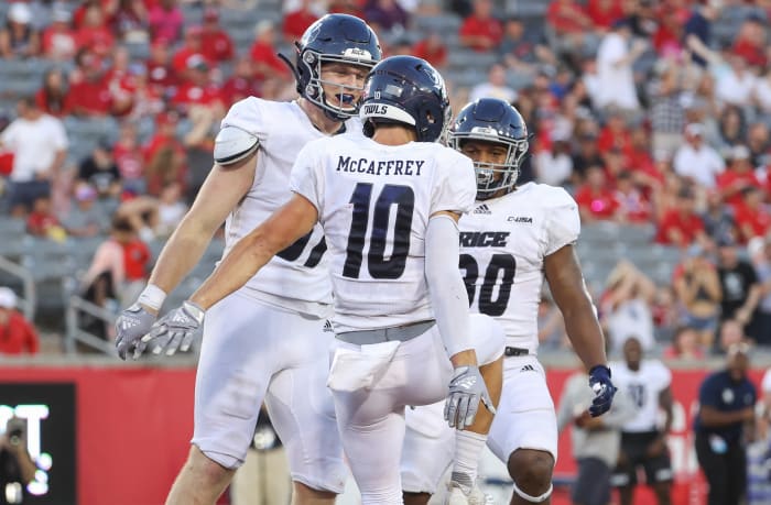 September 24, 2022;  Houston, Texas, USA;  Rice Owls wide receiver Luke McCaffrey (10) celebrates with tight end Jack Bradley (87) after scoring a touchdown during the third quarter against the Houston Cougars at TDECU Stadium.  Mandatory Credit: Troy Taormina-USA TODAY Sports