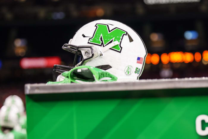 December 18, 2021;  New Orleans, LA, USA;  A Marshall Thundering Herd helmet on the equipment cart for a timeout against the Louisiana-Lafayette Ragin Cajuns during the first half of the 2021 New Orleans Bowl at the Caesars Superdome.  Mandatory Credit: Stephen Lew-USA TODAY Sports