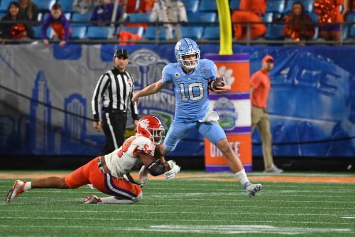 December 3, 2022;  Charlotte, North Carolina, USA;  Clemson Tigers Linebacker Jeremiah Trotter Jr.  (54) tackles North Carolina Tar Heels quarterback Drake Mayo (10) in the third quarter at Bank of America Stadium.