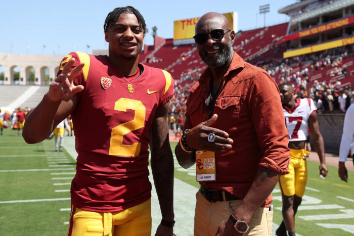 April 15, 2023;  Los Angeles, CA, USA;  USC Trojans wide receiver Brenden Rice (2) and Pro Football Hall of Famer Jerry Rice pose for a photo after the spring game at the Los Angeles Memorial Coliseum.  Mandatory Credit: Kiyoshi Mio-USA TODAY Sports