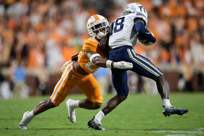 Tennessee defensive back Christian Harrison (29) tackles Akron Shocky wide receiver Jacques-Louis (18) Saturday, Sept. 17, 2022, at Neyland Stadium in Knoxville, Tenn.