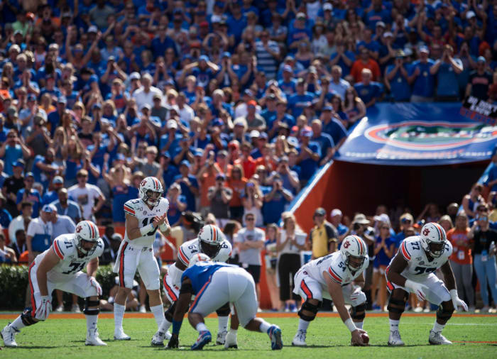 Auburn quarterback Bo Nix (10) lines up to snap the ball from center Kaleb Kim (54) at Ben Hill Griffin Stadium in Gainesville, Fla., on Saturday, Oct. 5, 2019. Florida defeated Auburn 24-13. Jc Auburnflorida 94