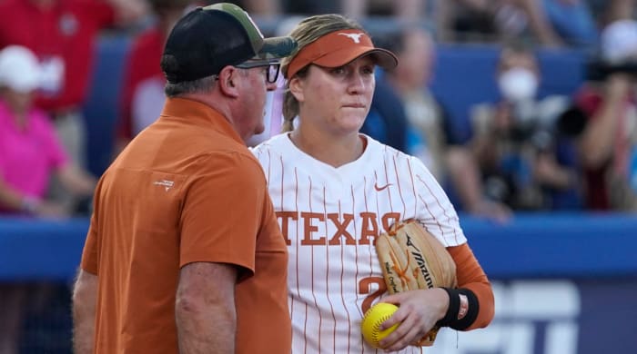 Texas pitcher Haley Dorcini is pulled in the first inning of Game 1 of the Women's College World Series