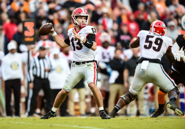 Nov 13, 2021; Knoxville, Tennessee, USA; Georgia Bulldogs quarterback Stetson Bennett (13) sets up to pass during the first half against the Tennessee Volunteers at Neyland Stadium. Mandatory Credit: Bryan Lynn-USA TODAY Sports