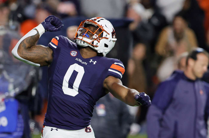 Oct 30, 2021; Auburn, Alabama, USA; Auburn Tigers linebacker Owen Pappoe (0) celebrates after a tackle for a loss against the Mississippi Rebels during the first quarter at Jordan-Hare Stadium. Mandatory Credit: John Reed-USA TODAY Sports