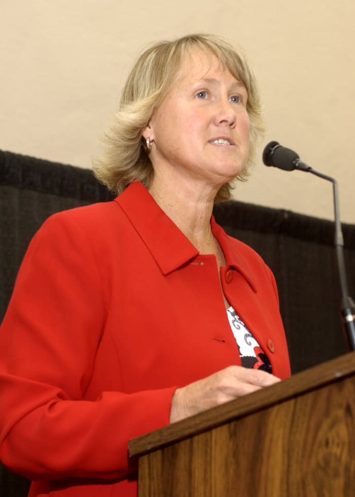 Cheryl Bailey speaking during an event while with the Wisconsin Athletic Department.