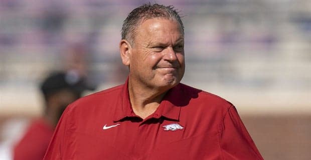 Arkansas Razorbacks football coach Sam Pittman stands on the sideline before a college football game in the SEC.