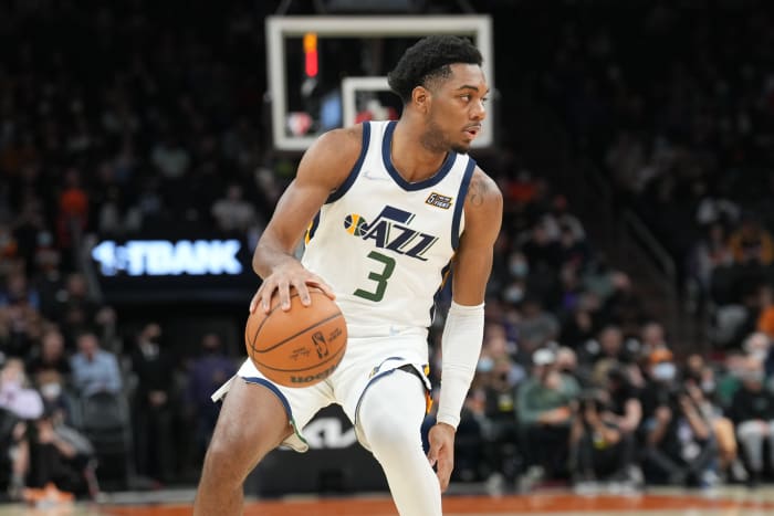 Utah Jazz guard Trent Forrest dribbles the ball.